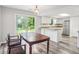 Cozy eat-in kitchen area with direct access to the backyard, featuring modern stainless steel appliances at 6249 Townsend Way, Riverdale, GA 30296