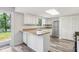 Efficient kitchen with white cabinetry, stainless steel appliances, and a skylight for abundant natural light at 6249 Townsend Way, Riverdale, GA 30296