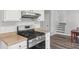 A well-lit kitchen featuring a stainless steel oven and modern appliances, creating an inviting cooking space at 6249 Townsend Way, Riverdale, GA 30296
