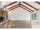 Open-concept living area highlighting high vaulted ceilings, a stone fireplace, and sliding glass doors to the outdoors at 6249 Townsend Way, Riverdale, GA 30296