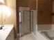 Bathroom features tiled floor, bathtub with tiled wall, and vanity, showing functionality at 1378 Lucile Sw Ave, Atlanta, GA 30310