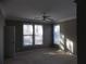 Neutral-colored bedroom with a ceiling fan, crown molding, and two windows offering lots of natural light at 1378 Lucile Sw Ave, Atlanta, GA 30310