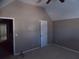 Bedroom with high vaulted ceilings, neutral walls, and ceiling fan creates spacious feel at 1378 Lucile Sw Ave, Atlanta, GA 30310