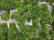 Aerial perspective of a residence with a pool amidst a mature treed neighborhood at 215 Ansley Ct, Roswell, GA 30076