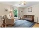 Bright Bedroom with hardwood floors, a crib, a glider and ample natural light at 215 Ansley Ct, Roswell, GA 30076