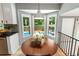 Sun-filled breakfast nook with views of the backyard and pool area, connected to kitchen at 215 Ansley Ct, Roswell, GA 30076
