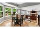 Bright breakfast nook with bay windows and natural light, adjoined to the living room at 215 Ansley Ct, Roswell, GA 30076
