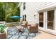 Relaxing deck area with outdoor seating, decorative rug, and access to home at 215 Ansley Ct, Roswell, GA 30076
