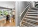 Foyer featuring hardwood floors, staircase, and an eat-in dining nook with natural light at 215 Ansley Ct, Roswell, GA 30076