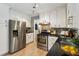 Charming kitchen featuring stainless steel appliances, modern finishes, and ample storage at 215 Ansley Ct, Roswell, GA 30076