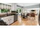 Open kitchen with stainless steel appliances and eat-in breakfast nook adjacent to the living space at 215 Ansley Ct, Roswell, GA 30076