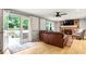 Inviting living room with fireplace and access to outdoor patio space at 215 Ansley Ct, Roswell, GA 30076