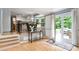 Cozy living space seamlessly connecting to the kitchen and outdoor patio area at 215 Ansley Ct, Roswell, GA 30076