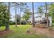Spacious backyard with mature trees, deck, shed and recreation equipment at 3220 Casteel Rd, Marietta, GA 30062