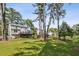 View of the home's backyard, deck, and mature trees at 3220 Casteel Rd, Marietta, GA 30062