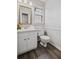 Compact bathroom featuring a vanity, updated fixtures and neutral tones at 3220 Casteel Rd, Marietta, GA 30062