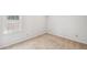Clean bedroom with a single window offering natural light at 3220 Casteel Rd, Marietta, GA 30062