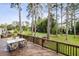 Wooden deck with outdoor dining set, overlooking the backyard at 3220 Casteel Rd, Marietta, GA 30062