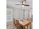 Cozy dining area with a ceiling fan, a light wood table and a view of the neighborhood at 3220 Casteel Rd, Marietta, GA 30062