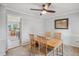 Cozy dining area with a ceiling fan, a light wood table and a view of the kitchen at 3220 Casteel Rd, Marietta, GA 30062