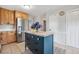 Bright kitchen featuring a kitchen island, a stainless steel refrigerator and tile floors at 3220 Casteel Rd, Marietta, GA 30062