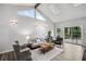 Bright living room with vaulted ceilings, skylights, and a sliding door to the outdoor deck at 3220 Casteel Rd, Marietta, GA 30062