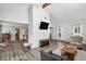 A spacious living room features vaulted ceilings, wood floors and natural light at 3220 Casteel Rd, Marietta, GA 30062