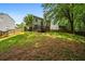 Fenced backyard with wood deck, providing an inviting area for entertaining and relaxation at 496 Bottesford Nw Dr, Kennesaw, GA 30144