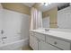 Bathroom featuring tile wall, bathtub, shower, and cabinet at 496 Bottesford Nw Dr, Kennesaw, GA 30144