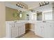 Bright bathroom with double sinks, large mirror, and separate shower at 496 Bottesford Nw Dr, Kennesaw, GA 30144