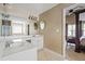 Bathroom featuring double sinks, shower and access to bedroom at 496 Bottesford Nw Dr, Kennesaw, GA 30144