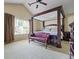 Bedroom with vaulted ceilings, canopy bed, and comfortable seating area at 496 Bottesford Nw Dr, Kennesaw, GA 30144