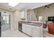 Modern kitchen with white cabinets, sleek appliances, and an open layout at 496 Bottesford Nw Dr, Kennesaw, GA 30144