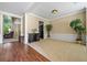 Bright living room featuring hardwood floors and neutral carpeting at 496 Bottesford Nw Dr, Kennesaw, GA 30144