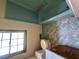 Vintage blue and white bathroom with a large window and tile walls at 9160 Carr Cir, Covington, GA 30014