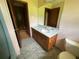 Bathroom featuring sink with vanity and a toilet at 9160 Carr Cir, Covington, GA 30014