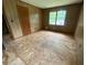 Bedroom featuring a window and unfinished floors at 9160 Carr Cir, Covington, GA 30014