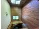 Bedroom featuring wood floors and paneling, with natural light from a large window at 9160 Carr Cir, Covington, GA 30014