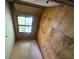 Bedroom featuring a window view to the exterior and unfinished floors at 9160 Carr Cir, Covington, GA 30014
