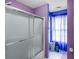 Contemporary bathroom featuring a glass shower door, with purple and blue decor at 2011 Wildcat Lake Ct, Lawrenceville, GA 30043