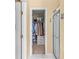 Bathroom with a walk-in shower and closet with shelving for storage at 2011 Wildcat Lake Ct, Lawrenceville, GA 30043