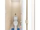 A small bathroom features a toilet and standard fixtures and finishes at 2011 Wildcat Lake Ct, Lawrenceville, GA 30043