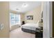 Cozy bedroom featuring a picture window and neutral decor at 2011 Wildcat Lake Ct, Lawrenceville, GA 30043