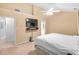 A simple bedroom with a ceiling fan and a TV, offering a peaceful retreat at 2011 Wildcat Lake Ct, Lawrenceville, GA 30043