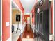 Hallway with hardwood floors, chair rail, and decorative artwork, providing a warm welcome at 2011 Wildcat Lake Ct, Lawrenceville, GA 30043