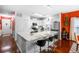 Bright white kitchen with stainless steel appliances, modern cabinets, an island and bar stool seating at 2011 Wildcat Lake Ct, Lawrenceville, GA 30043