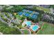 Aerial view of the community pool, clubhouse, tennis courts and parking area at 3163 Neal Ct, Cumming, GA 30041