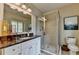Well-lit bathroom with granite countertop, double sinks, and glass-enclosed shower at 3163 Neal Ct, Cumming, GA 30041