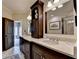 Elegant bathroom with double sinks, custom cabinetry, and a view to the bedroom for a seamless design at 3163 Neal Ct, Cumming, GA 30041