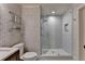 Tastefully designed bathroom with glass enclosed shower, patterned wallpaper, and modern fixtures at 3163 Neal Ct, Cumming, GA 30041
